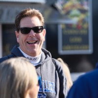 Man with sunglasses smiling at camera